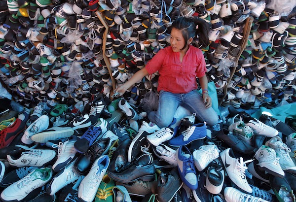Children stitch shoes for global market in India’s tourist magnet