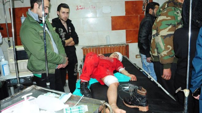 Syria war: Dozens killed as rockets hit Damascus market